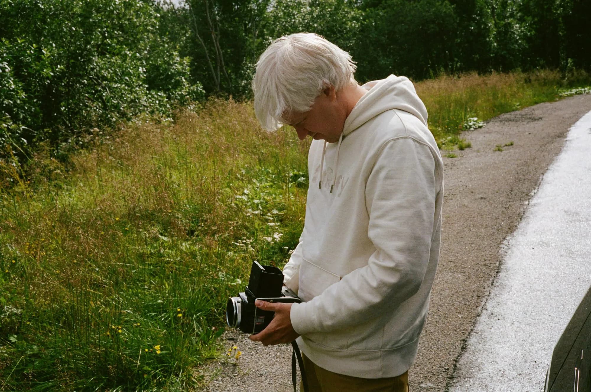 Pablo outdoors with an analog camera